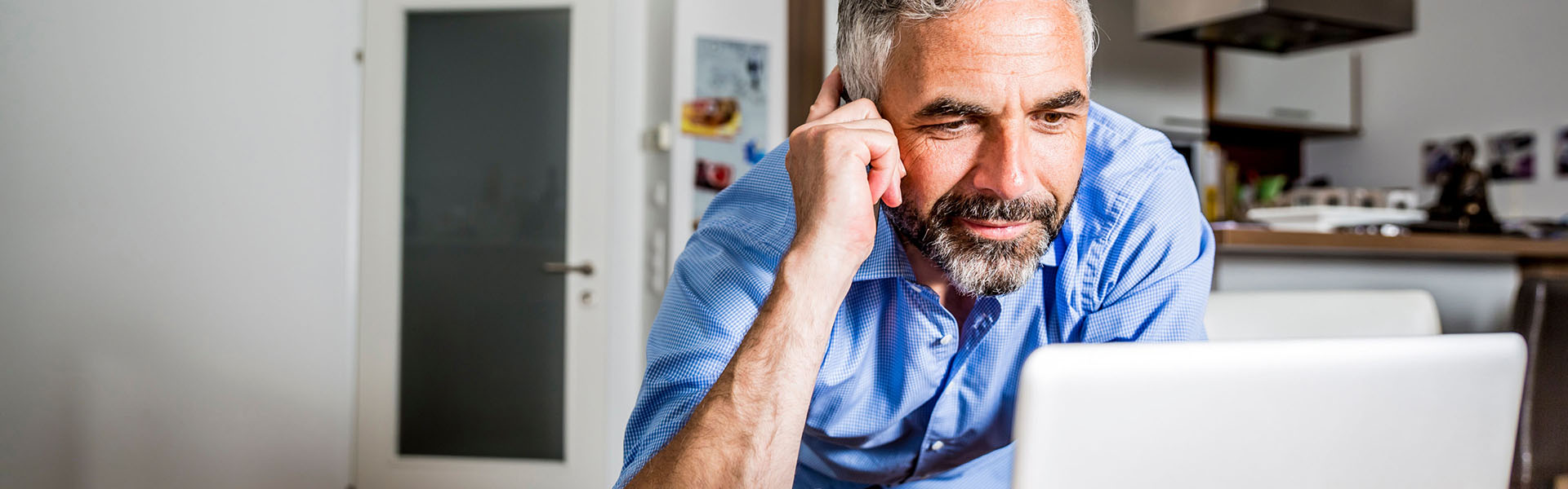 A man is working on his laptop.	