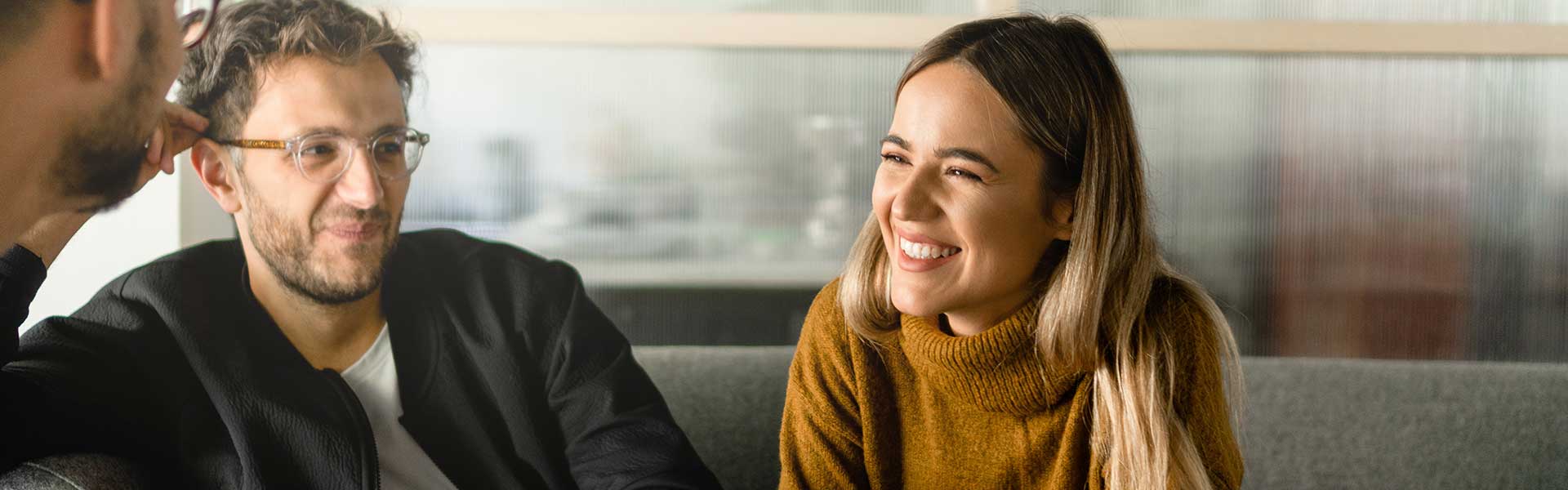 Coworkers collaborate in an office common space.